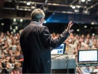 Speaker,Giving,A,Talk,On,Corporate,Business,Conference.,Unrecognizable,People