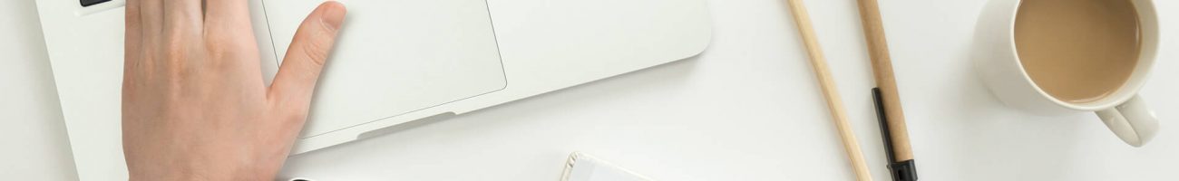 hand-working-on-a-laptop-another-holding-a-pen-PQX4439.jpg